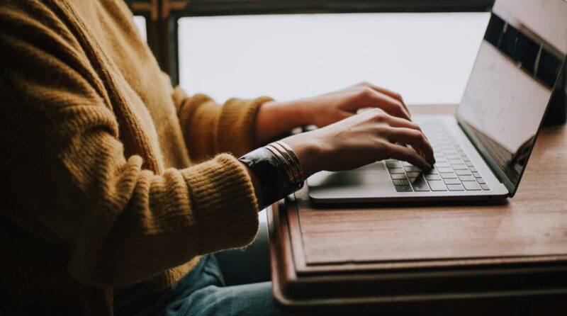 christin-hume-mfB1B1s4sMc-min person typing on laptop